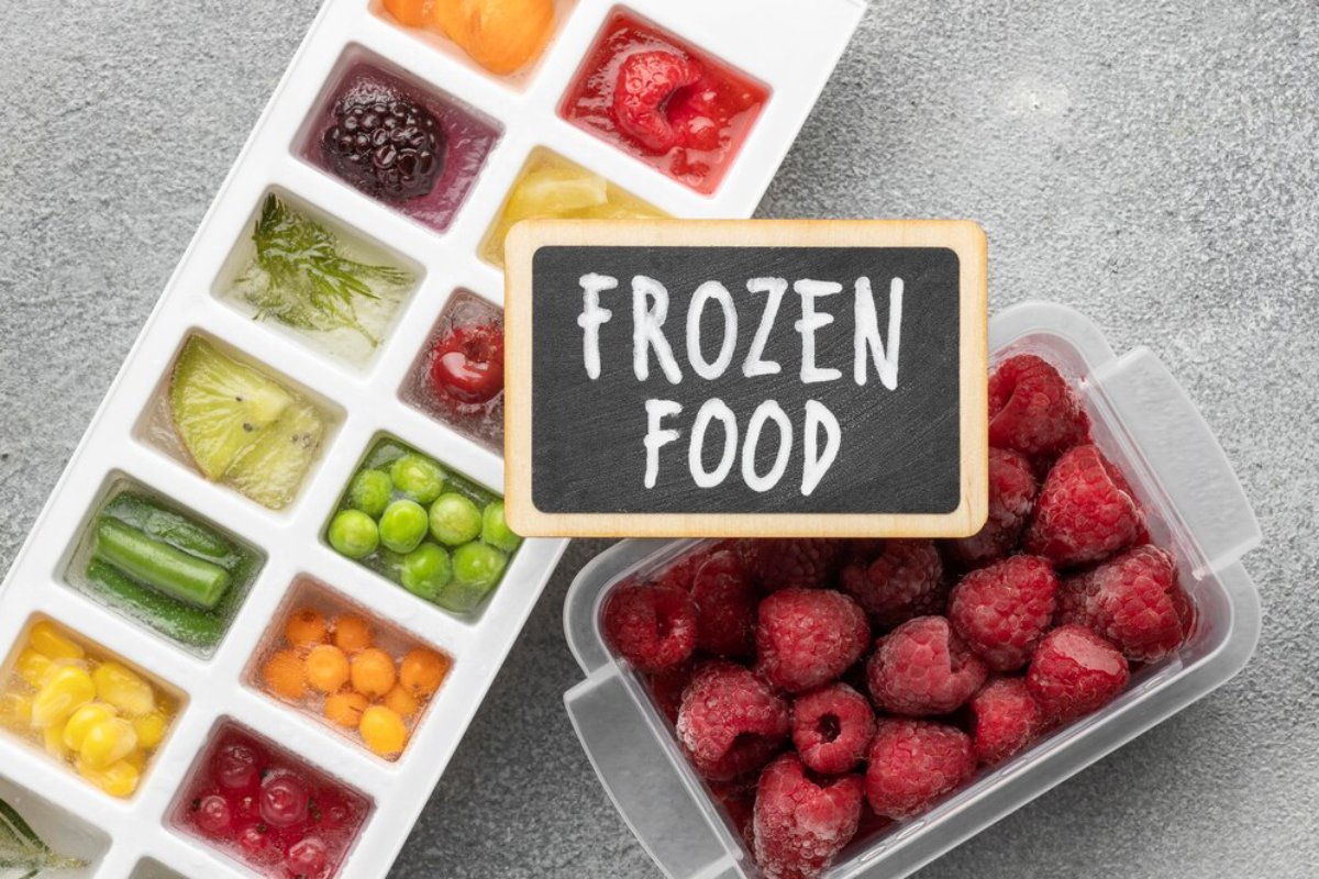 Assorted frozen fruits and vegetables in ice cube tray with 
